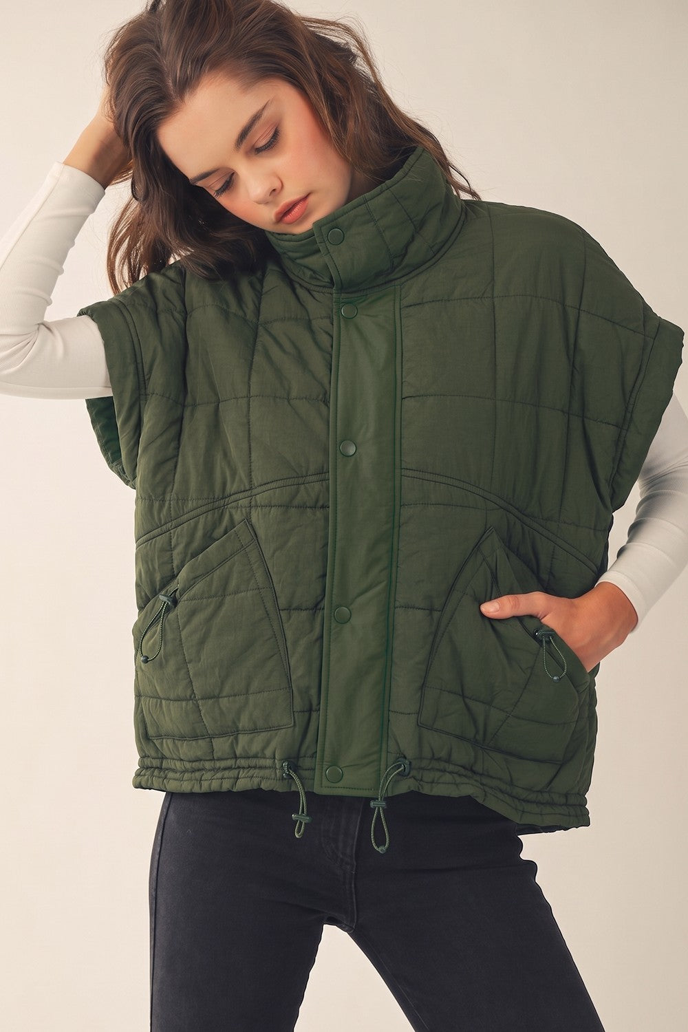 Apricot Lane Duluth olive green quilted puffer vest with snap buttons, side pockets, and a high neck