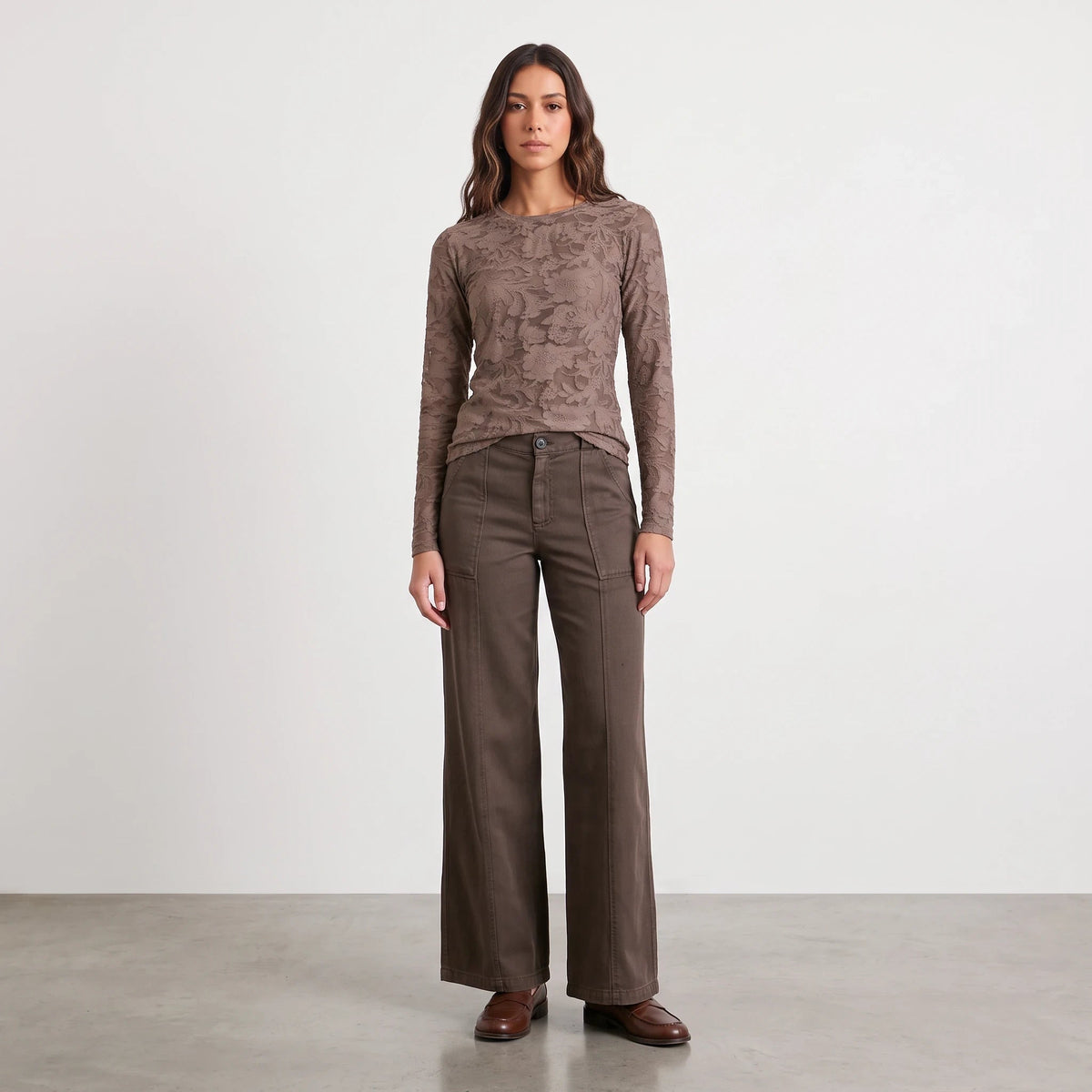 Model wearing Apricot Lane Duluth Roselyn floral long sleeve top in brown with matching wide-leg trousers and loafers.