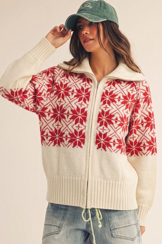 Model wearing an Apricot Lane Duluth zip-front cardigan with a red and white Nordic snowflake Fair Isle pattern.
