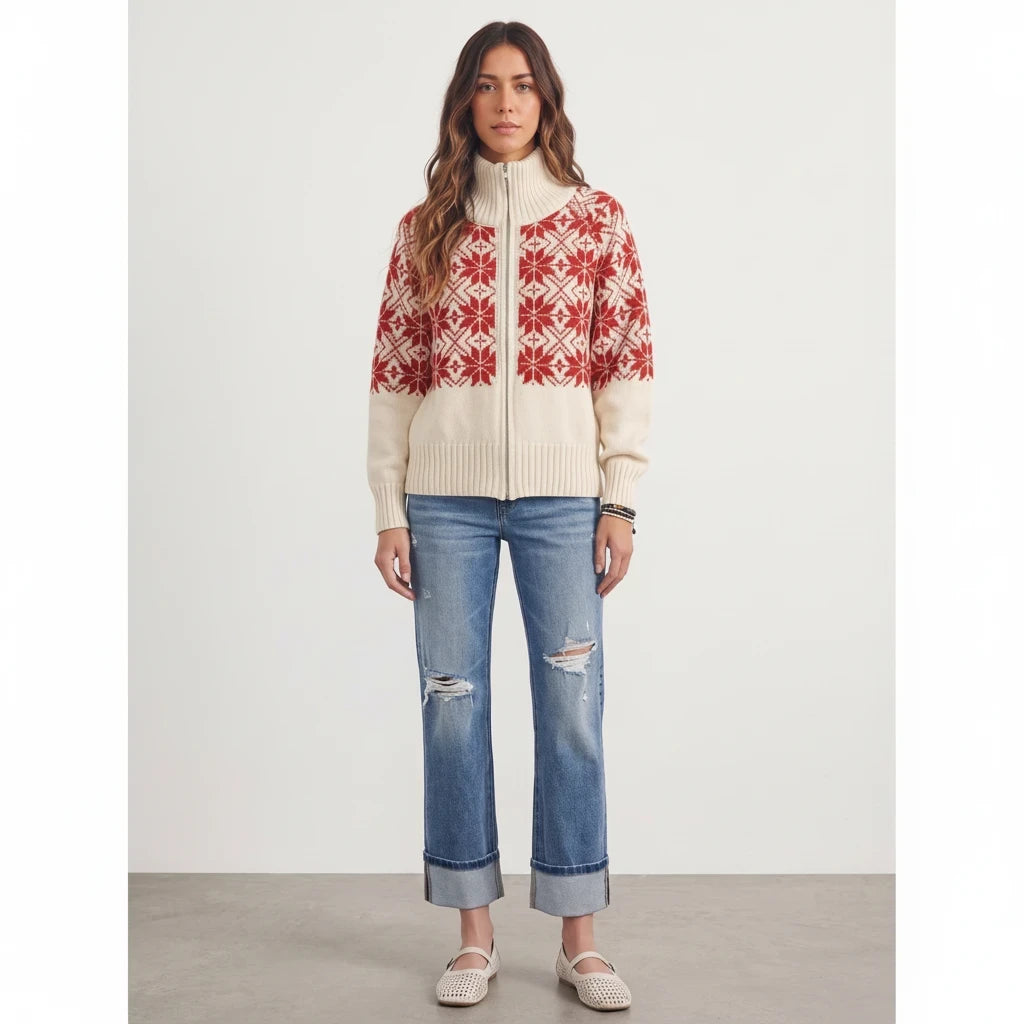 Model wearing Apricot Lane Duluth Nordic Snowflake Fair Isle zip cardigan in cream and red with distressed jeans