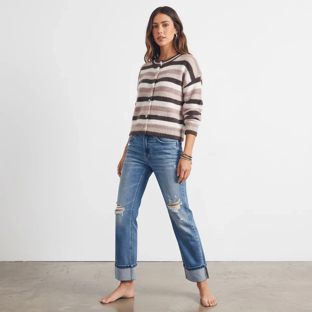 Model wearing Apricot Lane Duluth striped button-front cardigan with blue distressed jeans in a studio setting