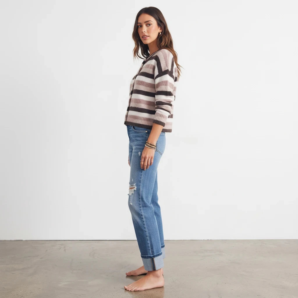 Model wearing Apricot Lane Duluth Sophie soft striped button-front cardigan with blue distressed denim jeans