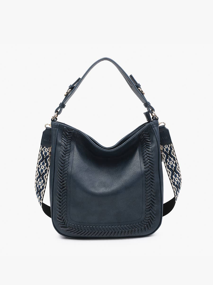 Black handbag with patterned strap on a white background