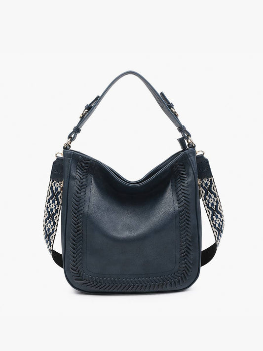 Black handbag with patterned strap on a white background